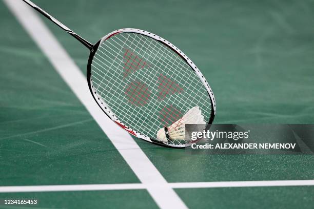 Taiwan's Chou Tien-chen scoops the shuttlecock between points against Sweden's Felix Burestedt in their men's singles badminton group stage match...