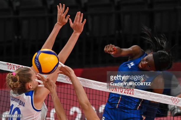 Italy's Paola Egonu spikes the ball in the women's preliminary round pool B volleyball match between Russia and Italy during the Tokyo 2020 Olympic...