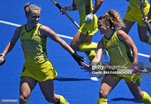 Australia's Stephanie Anna Kershaw and Ambrosia Malone celebrate a team's goal against Spain during their women's pool B match of the Tokyo 2020...