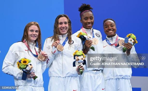 Bronze medallists USA's Erika Brown, USA's Abbey Weitzeil, USA's Natalie Hinds and USA's Simone Manuel pose on the podium after the final of the...