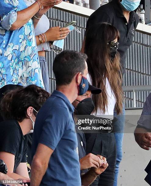 Coldplay singer Chris Martin and actress Dakota Johnson during the friendly match between FC Barcelona and Girona FC, played at the Johan Cruyff...