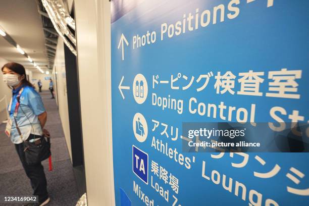 July 2021, Japan, Tokio: Swimming: Olympics, at the Tokyo Aquatics Centre. A sign points to the doping control station. Photo: Michael Kappeler/dpa