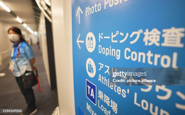 July 2021, Japan, Tokio: Swimming: Olympics, at the Tokyo Aquatics Centre. A sign points to the doping control station. Photo: Michael Kappeler/dpa