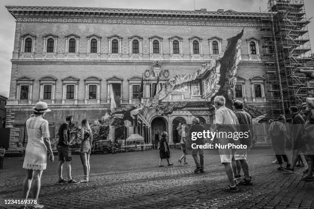 Image has been converted to black and white.) General view during the show of the art installation ''Punto di Fuga'' by JR on Palazzo Farnese on July...