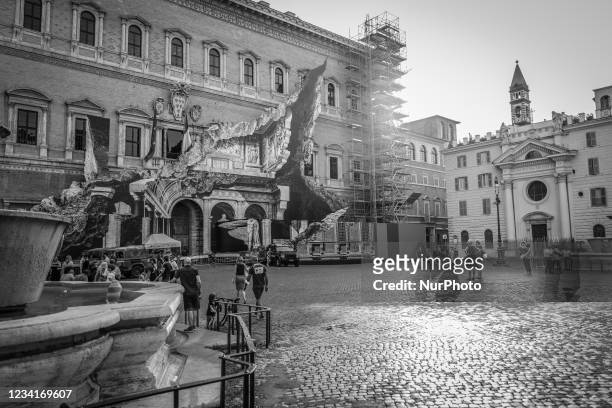 Image has been converted to black and white.) General view during the show of the art installation ''Punto di Fuga'' by JR on Palazzo Farnese on July...