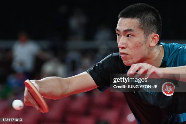 Hong Kong's Lam Siu-hang hits a shot against India's Sathiyan Gnanasekaran during his men's singles round 2 table tennis match at the Tokyo...