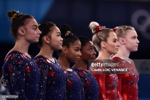 S Grace McCallum, USA's Sunisa Lee, USA's Jordan Chiles and USA's Simone Biles wait before competing in the artistic gymnastic women's qualification...