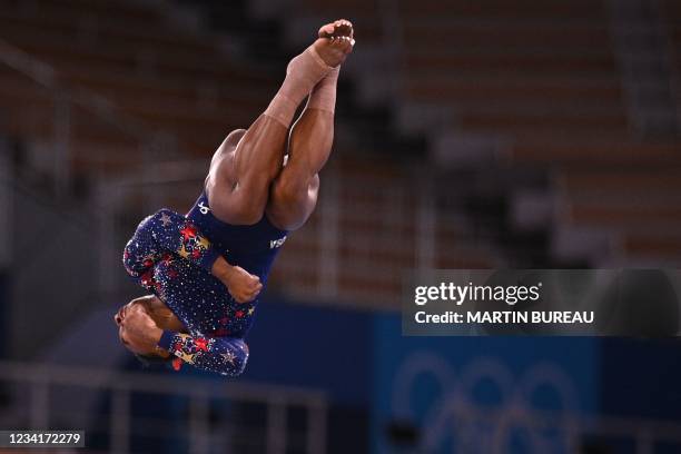 S Simone Biles competes in the floor event of the artistic gymnastic women's qualification during the Tokyo 2020 Olympic Games at the Ariake...