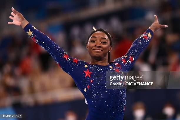 S Simone Biles reacts after competing in the artistic gymnastics balance beam event of the women's qualification during the Tokyo 2020 Olympic Games...