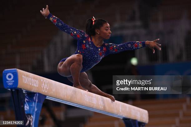 S Simone Biles competes in the artistic gymnastics balance beam event of the women's qualification during the Tokyo 2020 Olympic Games at the Ariake...