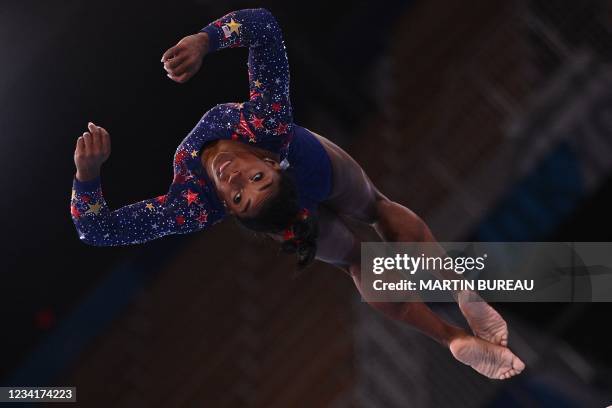 S Simone Biles competes in the artistic gymnastics balance beam event of the women's qualification during the Tokyo 2020 Olympic Games at the Ariake...