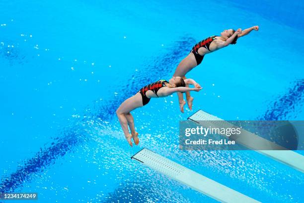 Lena Hentschel and Tina Punzel of Team Germany compete during Women's 3m Springboard Finals on day two of the Tokyo 2020 Olympic Games at Tokyo...