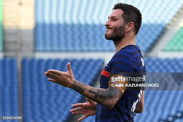 France's forward Andre-Pierre Gignac reacts after a missed chance during the Tokyo 2020 Olympic Games men's group A first round football match...