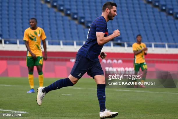 France's forward Andre-Pierre Gignac celebrates after scoring the equaliser during the Tokyo 2020 Olympic Games men's group A first round football...