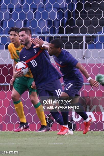 France's forward Andre-Pierre Gignac celebrates with France's forward Arnaud Nordin after scoring the second goal during the Tokyo 2020 Olympic Games...