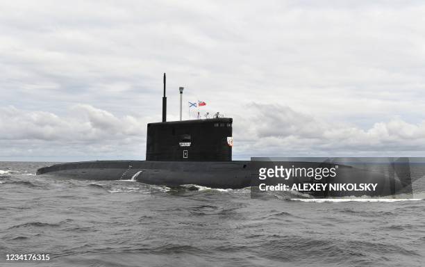 Soldiers of the Russian Navy stand on the Kilo-class submarine 'Petropavlovsk-Kamchatsky' as they take part in the Navy Day parade, celebrating the...