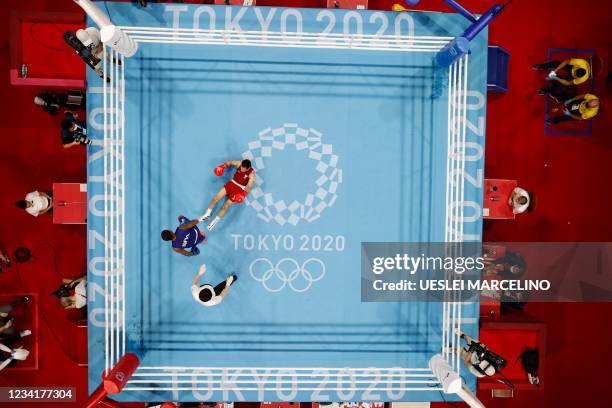 An overview shows Refugee Olympic Team's Wessam Salamana falling as he fights Brazil's Wanderson De Oliveira during their men's light preliminaries...