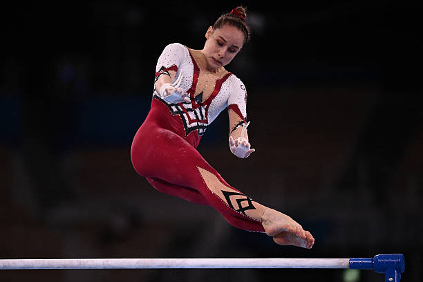 Germany's Sarah Voss competes in the uneven bars event of the artistic gymnastics women's qualification during the Tokyo 2020 Olympic Games at the...