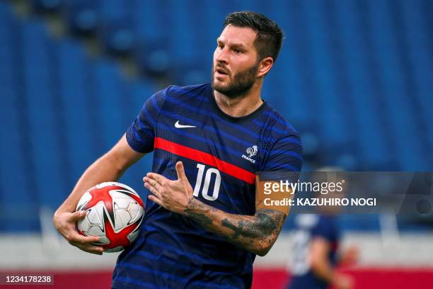 France's forward Andre-Pierre Gignac celebrates after scoring the third goal during the Tokyo 2020 Olympic Games men's group A first round football...