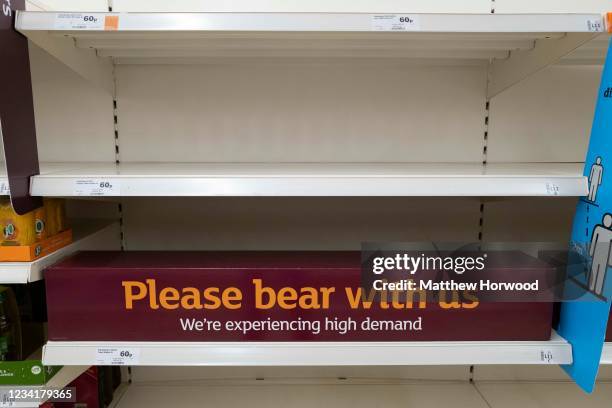 Empty shelves at a Sainsbury's store on July 25, 2021 in Cardiff, United Kingdom. Supermarkets across the UK are emptying of fresh produce and...