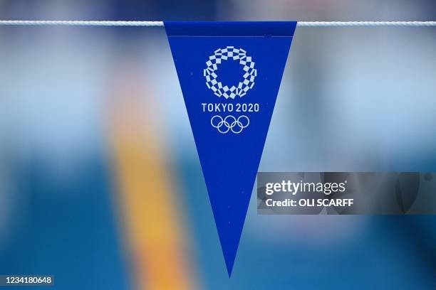 Logo is seen on bunting during a heat for the women's 100m backstroke swimming event during the Tokyo 2020 Olympic Games at the Tokyo Aquatics Centre...