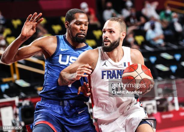 Kevin Durant of USA in action against Evan Fournier of France during the Group A basketball match between USA and France within the Tokyo 2020...