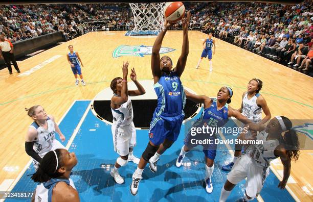 Quanitra Hollingsworth of the New York Liberty goes to the basket against Taj McWilliams-Franklin of the Minnesota Lynx during the game on September...