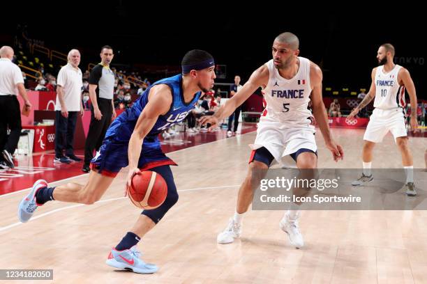 Devin Booker of Team United States controls the ball during the Men's Basketball Preliminary Round Group A - Match 4 between France and USA on Day 2...