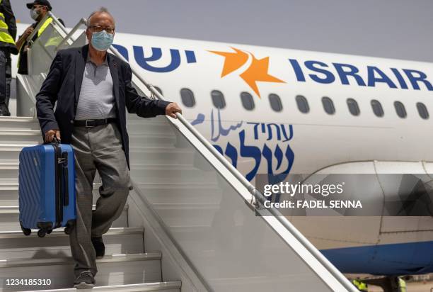 An Israeli tourist leaves the airplane upon arrival at the Marrakech-Menara International Airport on the first direct commercial flight between...