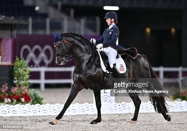 Sabine Schut-Kery of the United States and her horse participate in the equestrian dressage grand prix team and individual qualifier at the Tokyo...