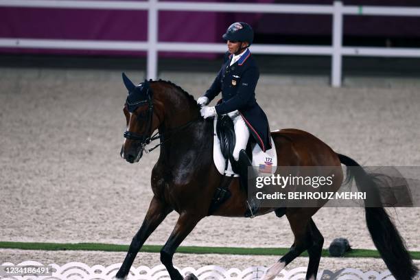 Steffen Peters of the US rides Suppenkasper in the dressage grand prix competition during the Tokyo 2020 Olympic Games at the Equestrian Park in...