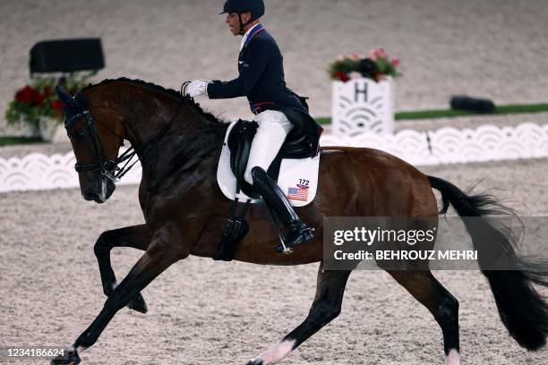 Steffen Peters of the US rides Suppenkasper in the dressage grand prix competition during the Tokyo 2020 Olympic Games at the Equestrian Park in...