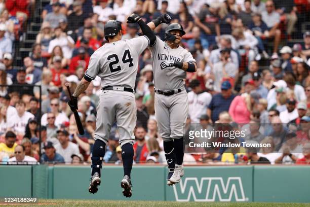 Rougned Odor of the New York Yankees is congratulated by Gary Sanchez after his home run against the Boston Red Sox during the sixth inning at Fenway...