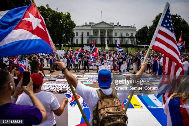 People protest in support of continued anti-government protests in Cuba on Pennsylvania Avenue outside of the White House on July 25, 2021 in...