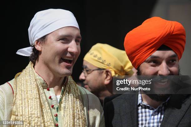 Federal Liberal opposition leader Justin Trudeau watches the colourful procession during the Khalsa Day Parade in Toronto, Ontario, Canada, on April...