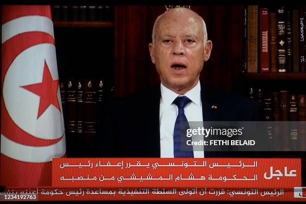 In a photo taken from the television station of President Kais Saied, Presidnet Saied announces, the dissolution of parliament and Prime Minister...