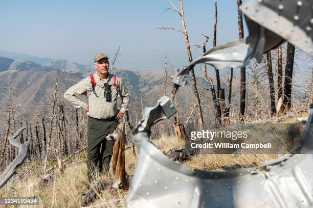 Montana Governor Greg Gianforte inspects the wreckage of a 1962 B-47 crash that killed four airmen at 8,500 feet on Emigrant Peak on July 24, 2021 in...