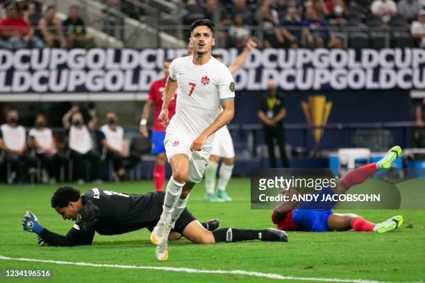 Canada's midfielder Stephen Eustaquio reacts after scoring during the Concacaf Gold Cup quarterfinal football match between Costa Rica and Canada at...