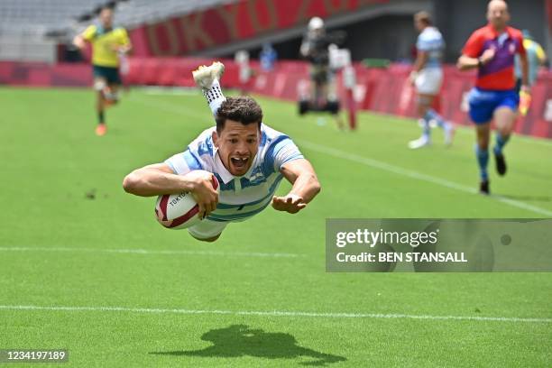 Argentina's Lautaro Bazan Velez scores a try in the men's pool A rugby sevens match between Australia and Argentina during the Tokyo 2020 Olympic...