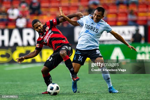 Brian Angulo of Tijuana and Erick Avalos of TIgres fight for the ball during the 1st round match between Club Tijuana and Tigres UANL as part of the...