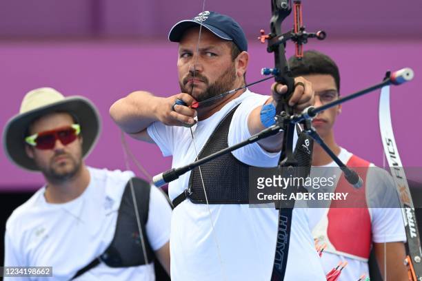 France's Jean-Charles Valladont, Pierre Plihon and Thomas Chirault competes in the men's team eliminations during the Tokyo 2020 Olympic Games at...