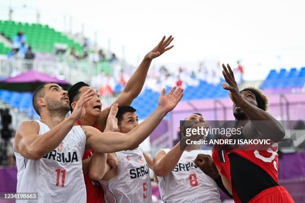 Serbia's Dusan Domovic Bulut, Japan's Tomoya Ochiai, Serbia's Aleksandar Ratkov, Serbia's Dejan Majstorovic and Japan's Ira Brown react as they eye...