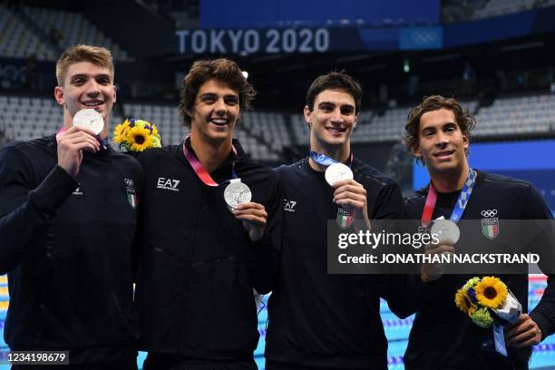 Silver medallists Italy's Alessandro Miressi, Italy's Thomas Ceccon, Italy's Lorenzo Zazzeri and Manuel Frigo pose with their medals after the final...