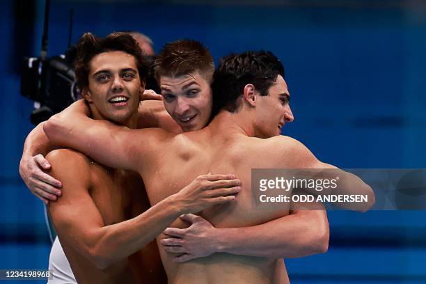 Silver medallists Italy's Alessandro Miressi, Italy's Thomas Ceccon, Italy's Lorenzo Zazzeri react as Italy's Manuel Frigo touched home second to...