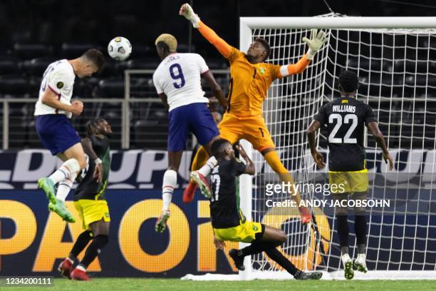 S forward Matthew Hoppe head the ball to score on Jamaica's goalkeeper Andre Blake during the Concacaf Gold Cup quarterfinal football match between...