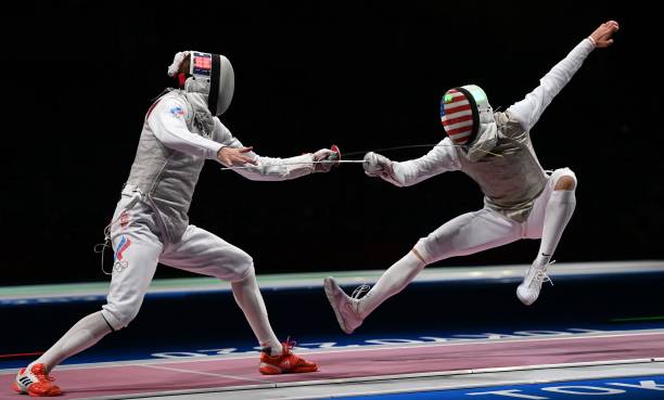 Russia's Kirill Borodachev compete against USA's Nick Itkin in the mens individual foil qualifying bout during the Tokyo 2020 Olympic Games at the...