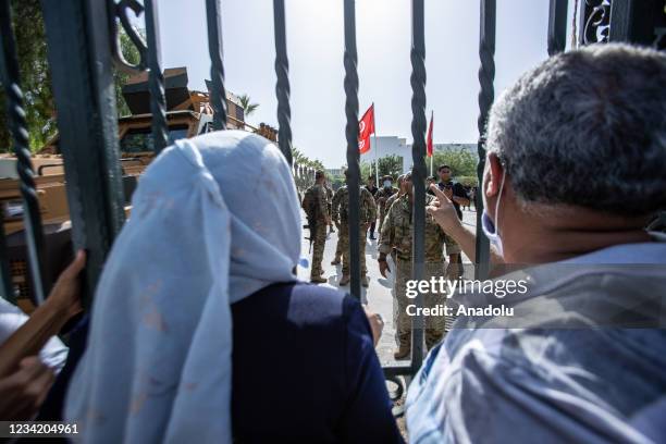 Security forces take security measures around parliament building as supporters and opponents of coup gather in front of parliament building after...