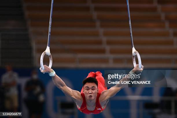 China's Wei Sun competes in the rings event of the artistic gymnastics men's team final during the Tokyo 2020 Olympic Games at the Ariake Gymnastics...