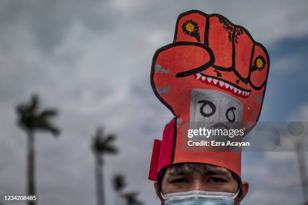 Filipino protesters attempt to march towards Philippine Congress to call for an end to Duterte's presidency on July 26, 2021 in Manila, Philippines....