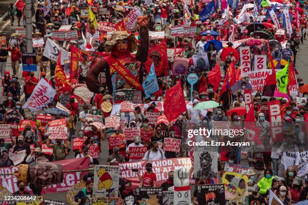 Filipino protesters attempt to march towards Philippine Congress to call for an end to Duterte's presidency on July 26, 2021 in Manila, Philippines....